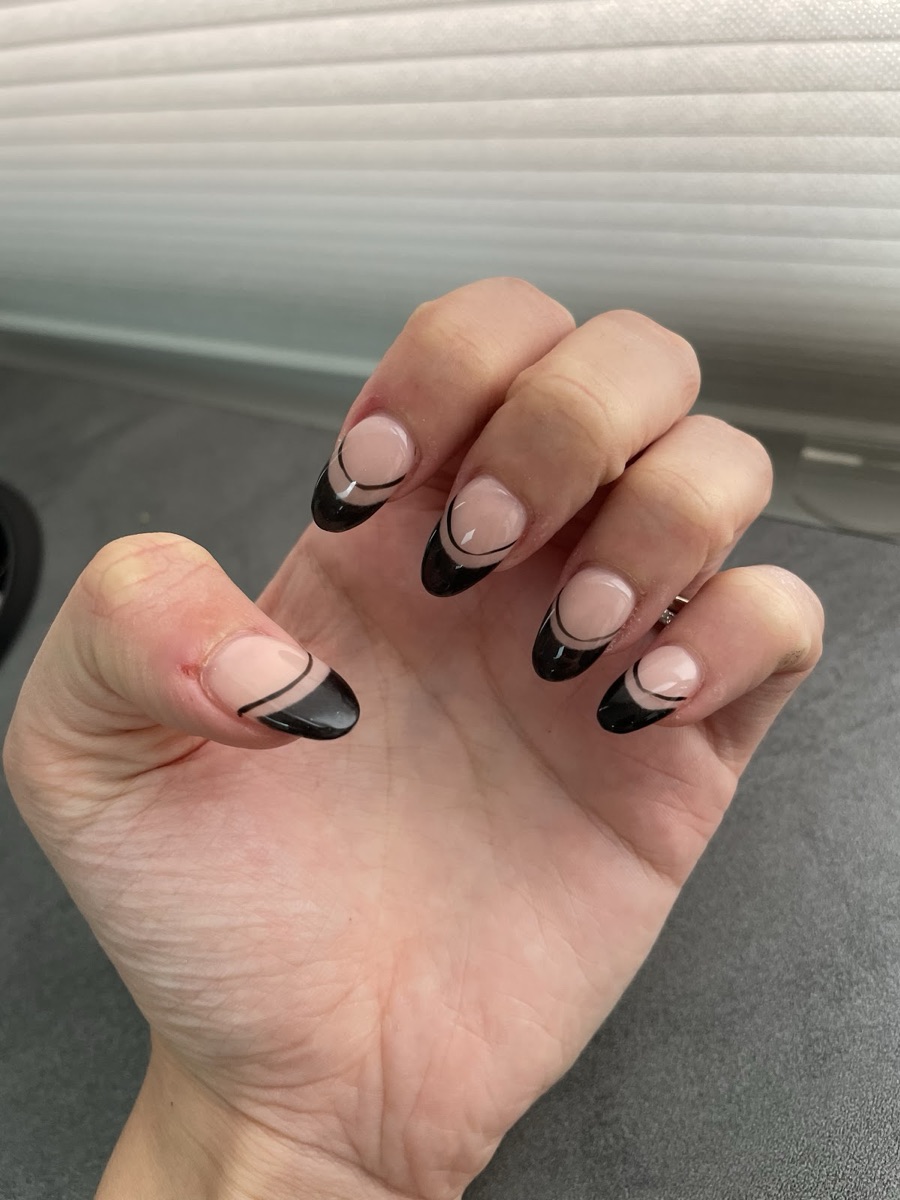 Glossy black French-tip almond nails