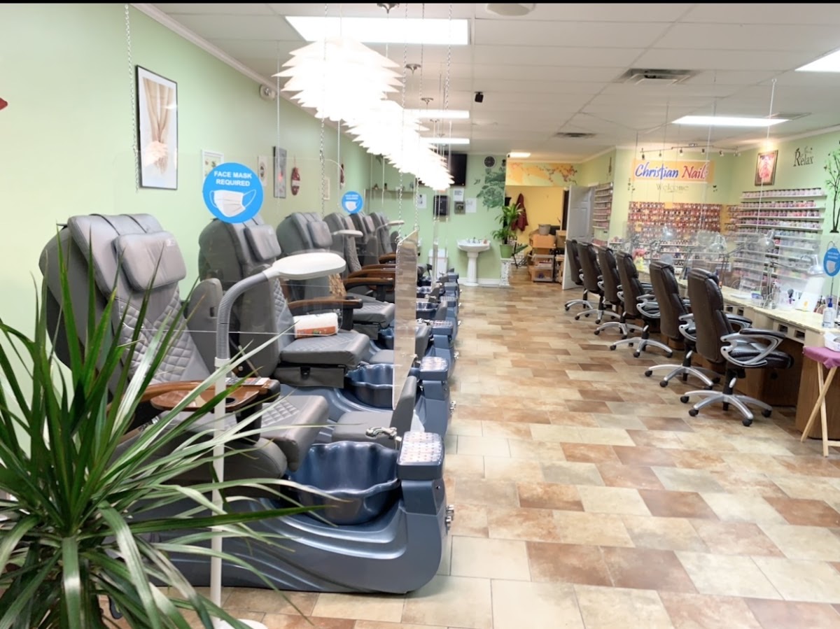 The bright, plant-filled interior of Christian Nails in Stockbridge, GA